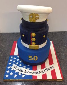 a cake made to look like a marine's hat on top of an american flag