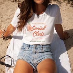 Yay! We're so glad you're here! Get ready for some Sweet Sanity in your life! This shirt is the cutest way to emit all those vintage beachy vibes! ♥ DETAILS: - Our tshirts are printed on classic jersey tees, so they are super soft and comfy. - Unisex tee, short sleeves, crewneck. (see sizing help below!) - 100% airlume combed and ringspun cotton. - Tear away label. ♥ CARE INSTRUCTIONS - Machine wash cold, inside-out, gentle cycle. - Tumble dry low or hang-dry. - Do not dry clean. - Do not iron. ♥ SIZING: These shirts are unisex size, not women's fitted shirts. If you want to go with the oversized look go up! If you'd like a more fitted look, we suggest that you size down. To get your size, lay your favorite shirt at home flat, measure armpit to armpit, and then compare to the size chart in Cute Custom Print Summer T-shirt, Cute Custom Print Shirt For Summer, Cute Summer T-shirt With White Print, Summer White Letter Print Shirt, Cute White Print T-shirt For Summer, Custom Print White T-shirt For Summer, Italia Shirt, Coastal Aesthetic, Beachy Vibes