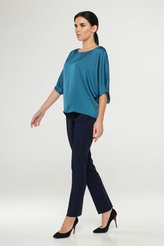 "A soft satin blouse featuring a boat neckline, half dolman sleeves, loose silhouette, and a relaxed fit. - kimono style blouse - loose silhouette - boat neck - half sleeves - Color: blue Fiber: 30% viscose, 70 % polyester. You may feel free choosing the size. Just send us your measurements (bust, waist, hips, height). We will define your correct size. SIZE CHART XS __ EU 34 __ US 4 bust: 31,5\" | 80 cm waist: 24,5\" | 62 cm hips: 34,5\" | 88 cm S __ EU 36 __ US 6 bust: 33,0\" | 84 cm waist: 26, Chic Silk Blouse With Relaxed Fit, Chic Viscose Blouse, Elegant Short Sleeve Viscose Tops, Elegant Solid Color Top With 3/4 Sleeves, Chic Short Sleeve Viscose Blouse, Blue Batwing Sleeve Blouse For Spring, Casual Blue Blouse With Batwing Sleeves, Chic Silk Stretch Top, Elegant Blouse With 3/4 Blouson Sleeves