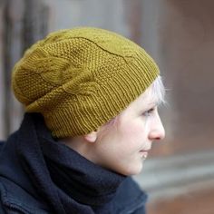 a woman wearing a yellow knitted hat