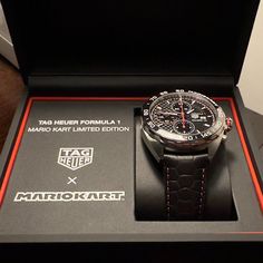 Tag Heuer Formula 1 Mario Kart Watch. Brand New Watch, Still Under Warranty With It's Original Box And Accessories. Watch Is 44mm With Leather Strap. Strap Has A 'Tortoise Shell" Pattern With Red Accent Stitching And Metal Clasp With Mario's M Inscribed. Many Unique Mario Details Throughout The Watch. Perfect For Any Mario Kart Lover. All Original, Bought Directly From Tag Heuer. Leather Chronometer Watch For Anniversary, Black Anniversary Watch Accessories With Chronometer, Designer Black Watch Accessories With Tachymeter, Designer Leather Watches For Anniversary, Luxury Chronograph Watch As Gift, Leather Chronograph Watch For Anniversary, Luxury Black Watch For Anniversary, Anniversary Leather Chronograph Watch, Modern Watch Accessories With Tachymeter For Gift