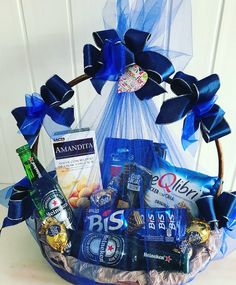 a basket filled with assorted snacks and drinks