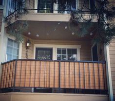 an apartment building with balconies on the balcony