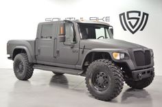 a large gray truck parked in a garage