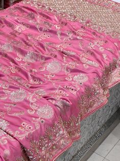 Add a touch of ethnic charm to your wardrobe with our Pink Banarasi Silk Jaal Embroidery saree. Made from the Banarasi silk, this saree features delicate jaal embroidery that adds a pop of color and texture. Be the talk of the town with this unique and playful saree. Luxury Banarasi Silk Saree With Floral Embroidery, Pink Pre-draped Saree With Intricate Embroidery For Navratri, Pink Art Silk Pre-draped Saree With Intricate Embroidery, Art Silk Pre-draped Saree With Intricate Embroidery, Bollywood Style Jamawar Pre-draped Saree For Diwali, Semi-stitched Katan Silk Traditional Wear With Intricate Embroidery, Eid Traditional Wear With Zari Work On Dola Silk, Wedding Jamawar Pre-draped Saree With Zari Weaving, Festive Jamawar Pre-draped Saree For Wedding