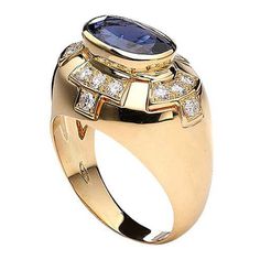 Ring in 18kt yellow gold set with one oval cut sapphire 4.29 cts and diamonds 1.07 cts Size 53