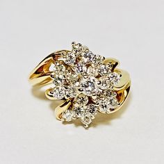 a yellow gold ring with diamonds on it