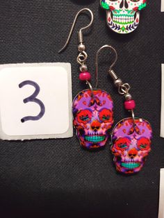 HANDMADE SUGAR SUGAR EARRINGS set 4 --choose from #1-9 and that exact one you will receive :) If you would like many please message us :) DETAIL IS AMAZING! NOT ONE IS THE SAME! COOLER IN PERSON! Set 4 Bohemian Skull Earrings For Gifts, Nickel Free Skull Jewelry For Day Of The Dead, Nickel-free Skull Jewelry For Day Of The Dead, Halloween Skull Jewelry With Skull Print, Pink Skull Jewelry For Halloween, Skull Shaped Jewelry For Day Of The Dead Party, Skull Jewelry For Day Of The Dead Party, Multicolor Halloween Earrings For Gift, Multicolor Halloween Earrings Gift