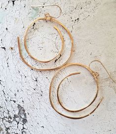 Light weight gold spiral statement earrings Modern Twist Small Hoop Earrings For Gift, Modern Twist Small Hoop Jewelry Gift, Modern Twist Small Hoop Earrings As Gift, Nickel Free Jewelry With A Modern Twist, Modern Gold Round Wrap Earrings, Modern Twist Round Earrings For Everyday, Elegant Spiral Wire Wrapped Jewelry, Gold Earrings With A Modern Twist For Everyday, Modern Twist Gold Earrings For Everyday