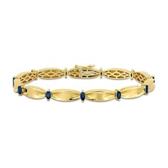 This stunning blue sapphire and 10K gold bracelet will add a touch of elegance to any outfit. 10K gold. Bracelet features solid cinched oval-shaped links joined by 4.0 x 2.0mm marquise-cut blue sapphire stations. 7.25-inch bracelet secures with a box clasp. Navy And Gold Jewelry, Classic Sapphire Diamond Bracelet, Classic Sapphire Bracelets For Formal Occasions, Elegant Blue Gold Bracelet For Formal Occasions, Yellow Gold Sapphire Tennis Bracelet For Formal, Classic Sapphire Bracelets For Anniversary, Yellow Gold Sapphire Tennis Bracelet For Formal Occasions, Classic Sapphire Diamond Bracelet For Anniversary, Formal Sapphire Tennis Bracelet In Yellow Gold