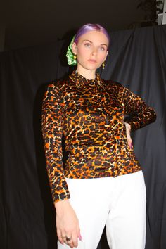 "Vintage 90s/y2k leopard print button down blouse. Polyester Size: Small Measurements- Shoulder to shoulder: 15\" Chest: 34\" Length: 23\" All sales are final! Our items are VINTAGE, meaning they have a 15+year history, a story! Due to the previous wear and passage of time, they may have resulting flaws or imperfections. If you have any questions or need more information and/or photos of items, feel free to reach out and I will provide you with that request ASAP. Items are shipped 3-5 business d Fitted Tiger Print Top For Fall, 90s Fitted Button-up Top, 90s Fall Button-up Tops, Y2k Leopard Print, White Knit Cardigan, Flared Sleeves Top, Black Leather Pants, Floral Sweater, Vintage Cardigan