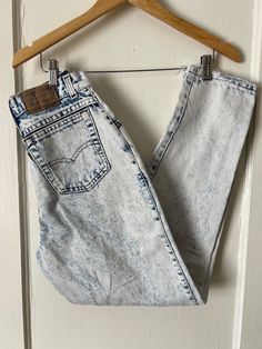 RARE incredible 1980s grunge Levi's from the 900 Series, complete with the silver tab. Perfectly distressed and worn in, despite being 100% cotton, they are soft and wearable. Super cute light wash/acid wash denim. Brown patch is in great shape for the age. In great vintage condition -- only visible flaw is a slight yellow stain on the front right leg, right between the pocket and the zipper (pictured in photo #2). Tag size 9, fits like a modern women's 2. Measurements (measured flat across, unstretched): Waist = 26" (doubled) Hips = 37" Rise = 11" Inseam = 29" Please read description carefully and view all photos. I describe and photograph all condition issues that I am aware of. I do my best to research and give the most accurate information regarding the item, but no one is perfect! Ple Vintage Stonewashed Bottoms For Spring, Spring Vintage Stonewashed Bottoms, Vintage Acid Wash Ripped Bottoms, 90s Distressed Cotton Jeans, 90s Style Distressed Cotton Jeans, Vintage Distressed Jeans For Spring, Vintage Stonewashed Cotton Bottoms, Vintage Ripped Fitted Jeans, Retro Acid Wash Cotton Jeans