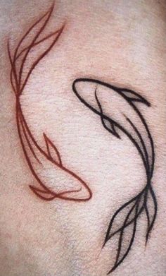 a tattoo on the back of a woman's stomach with a fish in it