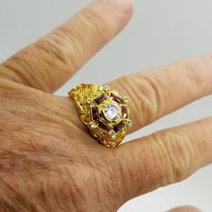 Mans Beautiful 18k Gold Plated Millionaires Ring. Centered Is A Full Cut Handplaced Aa Graded Cz Solitaire Surrounded With Bagette Cut Ruby Color Crystals. Small Cz's Are Placed Randomly To Complete This One Of A Kind Look. Anniversary Jeweled Rings Fine Jewelry, Diamond Rings With Jeweled Details, Diamond Jeweled Rings, Jeweled Diamond Rings, Formal Jeweled Diamond Rings, Formal Fine Jewelry Jeweled Rings, Diamond Jeweled Rings For Anniversary, Jeweled Diamond Ring For Anniversary, Anniversary Cubic Zirconia Jeweled Rings