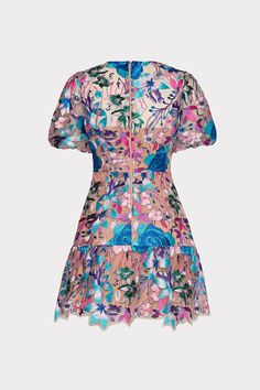 Elevate your cocktail party wardrobe with the Yasmin dress. This season’s version is done in our bursting bouquet of brightly colored and pastel floral embroidery atop a mesh overlay. This mini dress features a feminine, slightly puffed short sleeve with a ruffled skirt. Minimal accessories required. Whimsical Floral Dress, Feminine Floral Embroidered Dress For Garden Party, Spring Party Dress With Floral Applique, Summer Party Floral Dress With Floral Applique, Summer Party Floral Dress With Applique, Spring Party Floral Dress With Applique, Summer Party Floral Applique Dress, Spring Party Floral Applique Dress, Floral Embroidered Lace Mini Dress