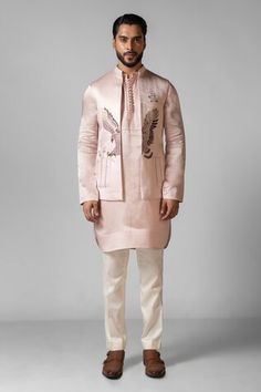 Rose pink . Paired with a Nehru Jacket hand embroidered with an eagle motif using Resham, chid and plain white pant. - Aza Fashions Pink Nehru Jacket With Zari Work For Spring, Spring Pink Nehru Jacket With Zari Work, Fitted Pink Embroidered Nehru Jacket, Pink Embroidered Nehru Jacket With Long Sleeves, Pink Embroidered Long Sleeve Nehru Jacket, Pink Embroidered Outerwear For Wedding, Pink Embroidered Wedding Outerwear, White Pant, Satin Hands