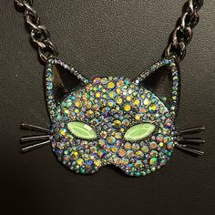 This Is A Gorgeous Piece From Betsy Johnson. Brand New With Tags Pendant Is A Large Cat Mask. The Eyes Are Supposed To Glow In The Dark. It Is Covered In Jewels That Are Blue And Iridescent. The Chain, Cat Whiskers, And Inside Of Cat Ears Are All Pewter In Color, This Is A Real Statement Piece To Get Lots Of Attention. So If You Love Cats Or If You Want Something Great To Wear For Halloween This Is The Necklace For You. Trendy Cat Design Jewelry For Party, Trendy Cat Design Jewelry For Parties, Seahorse Necklace, Betsey Johnson Necklace, Flower Statement Necklace, Mask Necklace, Seahorse Pendant, Rhinestone Statement Necklace, Cat Whiskers