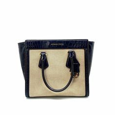 Get ready to turn heads with the Michael Kors Colette Tote Bag. Its navy and cream design exudes sophistication, while the leather and canvas construction adds a touch of luxury. With a crossbody purse charm, this versatile bag is perfect for any occasion. Whether you're heading to the office or out for a night on the town, this bag will elevate your style to new heights. Cream Tote Bag, Native American Jewelry Navajo, Cream Design, Vintage Trucker Hats, Leather And Canvas, Accessories Bags Purses, Purse Charms, Purse Jewelry, Kids Boots