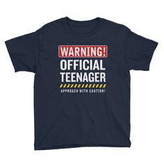 A funny outfit that reads Warning Official Teenager Approach with Caution in distressed text! Perfect for your thirteen year old boy or girl to wear on their special day! Makes a hilarious way to warn everyone that they're looking at a young adult! A great 13th birthday gift idea or a fun Christmas present for your teenage kid! Get this funny tshirt to celebrate the new milestone your son, daughter, brother, sister, niece, nephew, grandson or granddaughter has achieved! A lightweight youth tee, Thirteenth Birthday, 13th Birthday Gifts, Teenager Birthday, Tenth Birthday, Big Brother Shirt, Best Christmas Presents, Brother Shirts, Funny Outfits, Gaming Shirt