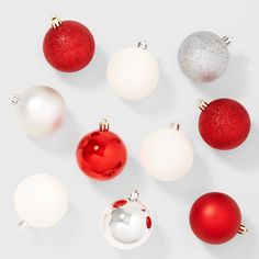 red and white christmas ornaments arranged in a circle