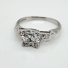 a white gold ring with three stones on it