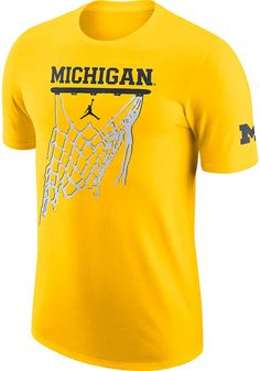 Show off your team pride in this Michigan Wolverines Gold Jordan Icon Short Sleeve T Shirt! This Michigan Short Sleeve Tee features a screen print of Michigan over Jordan Icon graphic with left sleeve team logo hit. Make sure everyone knows you root for the Wolverines with this Gold Michigan T Shirt. Go Michigan! Nike Cotton T-shirt With Team Logo, Nike Cotton T-shirt In Team Colors, Nike Team Spirit Cotton T-shirt, Nike Cotton T-shirt With Team Spirit Style, Nike Graphic Tee For Fan Gear, Nike Cotton Fan Apparel T-shirt, Team-colored Nike Tops With Graphic Print, Nike Tops In Team Colors With Graphic Print, Nike Tops With Screen Print For Fans