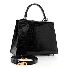 This is an authentic HERMES Shiny Porosus Crocodile Kelly Sellier 25 in Black. This elegant tote is crafted of exotic crocodile in black. This shoulder bag features a top handle, an optional detachable shoulder strap, a flap with a strap closure, polished gold plated hardware including a Kelly turn lock, a covered padlock, and a key clochette. The flap opens to a matching leather interior with zipper pocket and patch pockets. Kelly Sellier, Leather Interior, Patch Pocket, Top Handle, Zipper Pocket, Shoulder Strap, Gold Plate, Key, Shoulder Bag