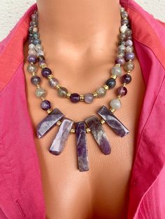 Amethyst and Fluorite Layered Necklace Set This elegant necklace set is a great gift for yourself and your loved ones. Made from natural crystal beads. All metal ornaments are gold plated and won't get darker in time! FREE SHIPPING - All orders get shipped within 1-2 business days. - 5-10 days of delivery time Returns are allowed 14 days after the delivery, however, the cost of delivery lies on the buyer. For more bracelets and necklaces!: https://finecrystalsdesign.etsy.com How to care for your necklace: * Avoid getting moisture, alcohol and perfume, if you do please dry the product with clean cloth. Please take off your necklace before swimming or taking shower. Understanding Dreams, Metal Ornaments, Necklace Purple, Layered Necklace Set, Purple Jewelry, Bracelets And Necklaces, Design Statement, Elegant Necklace, Trendy Necklaces