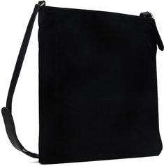 Suede messenger bag in black. · Buffed leather trim throughout · Adjustable and detachable crossbody strap · Logo embossed at face · Open throat · Zip pocket at suede interior · H15.75 x W13.5 Supplier color: Black Black Suede Luxury Shoulder Bag, Luxury Black Suede Shoulder Bag, Luxury Black Suede Bags, Black Suede Bag For Formal Occasions, Modern Black Suede Bags, Black Suede Bag With Detachable Strap, Black Suede Travel Bag, Black Suede Shoulder Bag For Travel, Black Suede Crossbody Bag