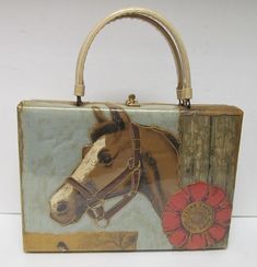 Delill Vintage Cedar Farms Horse Show Purse Handbag Pocketbook.  Rare and unique.  Well cared for pre-owned vintage condition. Rectangular shaped vintage Delill purse handbag appears to be a fabric laminated with plastic covering.   Outer bag detail is then outlined by gold tone embroidery style stitching around the graphics as pictured.  Theme is "Cedar Farms Horse Show."  Handbag measures approximately 11 1/2" wide x 8" tall x 3" deep plus cream tone laminated or plastic covered handles with a Timmy Woods Wood Horse Tuxedo Purse, Vintage Tote Box Bag For Travel, Vintage Pouch Box Bag For Travel, Vintage Square Box Bag For Travel, Vintage Handheld Travel Bag, Vintage Gold Travel Bag, Vintage Gold Bag For Travel, Vintage Box Bag With Detachable Handle, Vintage Tote Box Bag With Detachable Handle