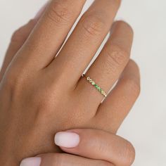 Inspired by the mystical allure of birthstones, this delicate 14k gold ring features an ombre gemstone arrangement of tsavorite, olivine and white topaz. 

The mesmerizing transition of hues makes it a perfect and meaningful gift for yourself or a loved one born in August.


Tsavorite (August birthstone) is the stone of compassion

Olivine is the stone of self confidence

White topaz is the stone of truth and clarity

3 deep tsavorite stones, each with a width of 1.75mm

4 light olivine stones, Green Diamond Stackable Rings With Birthstone, Elegant Green Stackable Rings With Birthstone, Tsavorite Birthstone Ring For May, Elegant Peridot Stackable Rings For May Birthstone, Dainty Green Diamond Birthstone Ring, Green Half Eternity Stackable Rings Fine Jewelry, Elegant Green Birthstone Stackable Rings, Tsavorite May Birthstone Ring, Green Diamond Dainty Birthstone Ring