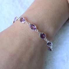 Amethystbracelet, natural amethyst, Sterling silver bracelet, 8 inches long, dainty bracelet, gemstone bracelet, 92.5 silver Description: Stand out of the crowd with this lovely natural faceted amethyst bracelet. The design is simple. And adds to the elegance of this beautiful stone. The color of the gemstone is such that it will go well with all attires. I make the gemstones myself for my valued customers so I assure you that the gemstones are Natural and are made from ethically sourced roughs. Chalcedony Ring, Rose Quartz Earrings, Sterling Bracelets, Dainty Bracelet, Bracelet Gemstone, Amethyst Jewelry, Alternative Engagement Rings, Amethyst Bracelet, Dainty Bracelets