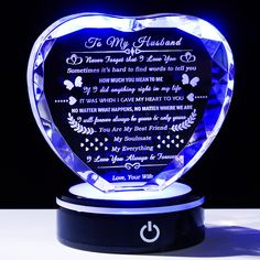 an illuminated heart shaped glass plaque with the poem to my husband on it's side