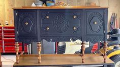 an old dresser is being worked on in a garage