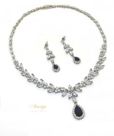 "❤️ Best seller Sapphire wedding jewelry set for brides! Luxurious and elegant, diamond look bridal necklace and earrings set made with clear AAA grade, Cubic Zirconia stones featuring a Sapphire Blue Cubic Zirconia teardrop. This luxurious jewelry set is very elegant and has lots of sparkle. - The necklace is 17.5 inches long and has 2 inches extension chain for an extra length. - Matching Earrings: made with Sapphire blue CZ teardrops and clear marquise cut clear CZ stones in luster rhodium pl Sapphire Necklace Wedding, Saphire Jewelry, Blue Sapphire Jewelry Set, Sapphire Jewelry Set, Crystal Wedding Necklace, Blue Jewelry Set, Crystal Bridal Jewelry Sets, Blue Wedding Jewelry, Blue Sapphire Jewelry