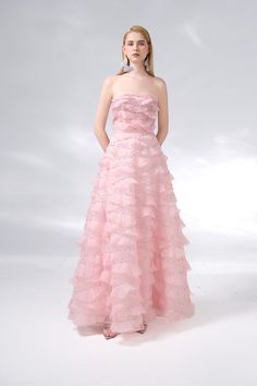 This dress is the perfect choice for a formal event. The dress features an elegant strapless design and is made of high-quality organza fabric. Its floor length adds a touch of sophistication to any occasion. Make a statement with this beautiful dress. *Product length is measured from the shoulder to the hem. Glamorous Strapless Prom Ball Gown, Floor-length Gown For Debutante Ball Gala, Glamorous Strapless Gown For Debutante Ball, Organza Ball Gown With Sweetheart Neckline For Prom, Prom Season Organza Ball Gown Evening Dress, Gala Party Organza Evening Dress, Strapless Tulle Evening Dress, Strapless Ball Gown Dress For Prom, Glamorous Strapless Dress For Prom Season And Debutante Ball