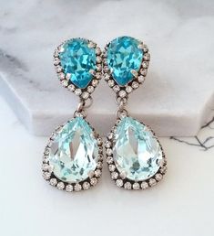 ✤ I can make these earrings with many other colors to match your wedding party scheme (or any other occasion). Please just contact me.✤ Matching bracelet is available here:https://etsy.me/2KnQ8N7✤ Made with CRYSTALLIZED™ - Swarovski crystals.✤ Available in other metal finishes at the drop-down menu.✤ Post Earrings. Clip-on earrings are available upon request.✤ Size  - 4.5 x 1.7 cm at the widest points.✤ Light weight - 7 gr for each earring.✤ Colors: Light azure, light turquoise, clear crystal, o Bridal Long Earrings, Wolfie Cindy, Blue Earrings Wedding, Light Blue Earrings, Blue Bridal Earrings, Long Bridal Earrings, Bridal Earrings Studs, Oxidized Silver Earrings, Bridal Earrings Chandelier