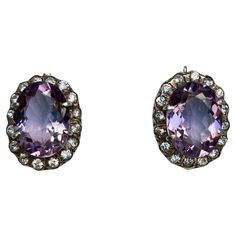 Pair of vintage European stunning amethyst drop earrings. Beautiful large oval amethyst surrounded with sparkling cubic zirconia, mounted in sterling silver marked 925, about 0.98 inch by 0.78 inch, weight about 13 grams. Vintage European, European Vintage, Sterling Earrings, Vintage Stil, Jewelry Earrings Dangle, Cubic Zirconia, Dangle Earrings, Amethyst, Jewelry Earrings