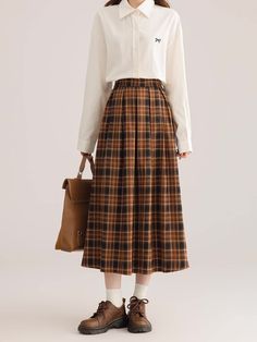 Pleated plaid midi skirt in cozy colors to go with your autumnal fits. Features an elastic waist back. Lined. One Size: 26"-36" waist, 31" length Plaid Midi Skirt Casual Style, Casual Plaid Midi Skirt, Plaid Midi Skirt For Fall, Casual Full Skirt For Fall, Casual Plaid Skirt For Fall, Fall Midi Skirt With Elastic Waistband, Casual Plaid Skirt For Work, Casual Plaid Pleated Skirt, Casual Flared Pleated Skirt For Fall