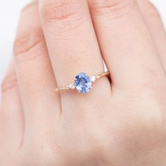 One of a kind ring Stock size: Size 7 Re-sizable size: Size 4-8.5 0.98ct Ceylon Blue Sapphire, 6.91x5.56mm Beautiful blue color, very clean, no visible inclusions. 0.04ctw G SI white accent diamonds Band width x height: approx. 1.4mm x 1.5mm High profile, four-prong flower setting made of recycled solid 14k gold Our Dedication All our jewelry is designed and created by Kat with great attention to details and the entire production from casting, stone setting to finishing takes place in New York, Oval Blue Tanzanite Sapphire Ring, Oval Tanzanite Blue Rings, Blue Oval Sapphire Ring With Prong Setting, Blue Oval Sapphire Ring For Proposal, Oval Blue Sapphire Ring For Proposal, Blue Sapphire Birthstone Wedding Ring, Sapphire Ring Vintage, Engagement Ring Alternative, Montana Sapphire Engagement