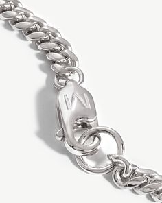 Round Curb Chain Bracelet. An Everyday Stacking Staple. Featuring a Soft Curb Chain and Rounded Edges, this Distinctive Bracelet is a Classic Addition to Your Arm Stack. Pair with a Chunky Chain to Create Contrast. Metal: Sterling Silver Dimensions: M - 190mm (No Extension), L - 210mm (No Extension) Chain Width: 4. 16mm Weight: 7. 56g Product Code: Mj-S-B2-Ns-M White Gold Cuban Link Bracelet With Solid Construction, Adjustable Silver Cuban Link Metal Bracelet, Modern Cuban Link Chain Bracelet With Solid Construction, Modern Silver Cuban Link Chain Bracelet, Modern White Gold Cuban Link Bracelet, Silver Curb Chain Minimalist Bracelet, Silver Minimalist Curb Chain Bracelet, Modern White Gold Chain Bracelet With Lobster Clasp, Everyday Silver Curb Chain Bracelets