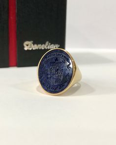 Sodalite Coat of Arms Signet Ring that can be personalized with your desired Family Crest design. A handmade piece that has been brought to life with the combination of fine goldsmith techniques and the latest technology. 📩 Leave us a message with your custom personalization, your family crest, coat of arms, logo or any design imagined. If you would like a different gemstone instead, please contact us. Gemstone Signet Ring - Coat of Arms Ring - Armorial Ring - Wax Seal Ring - Family Crest Ring Luxury Enamel Gemstone Ring For Gift, Collectible 14k Gold Signet Ring With Gemstone, 14k Gold Gemstone Signet Ring Collectible, Timeless Cabochon Sapphire Ring Gift, Timeless Gift Sapphire Cabochon Ring, Luxury Oval Enamel Ring For Gifts, Hallmarked Oval Rings For Memorial, Classic Oval Hallmarked Enamel Ring, Oval Enamel Gemstone Ring In 14k Gold