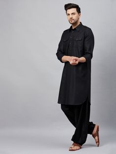 VM By VASTRAMAY Men's Black Pathani Suit Set Look sharp and stylish in this classic black pathani suit set from VM By VASTRAMAY. Perfect for any occasion, this set features a comfortable cotton blend kurta with a shirt collar, button placket, long sleeves, and two pockets. The kurta is paired with matching black patiala pants with an elasticated waistband and drawstring closure for a relaxed fit. Key Features Black solid straight knee-length kurta Shirt collar with button placket Long sleeves wi Black Pathani, Pathani Suit, Kurta Shirt, Suit Set, Black Solid, Shirt Collar, Button Placket, Classic Black, Outfit Sets