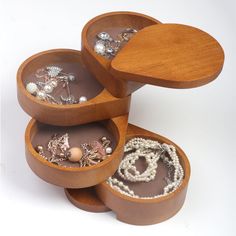 an assortment of jewelry in wooden containers