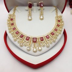 "CZ American Dimonds Heavy Gold Rhodium Plated Cubic Zirconia Bridal Indian Jewelry Wedding Necklace Set Handmade indian Jewellery It is a perfect match with formal attire on special occasions or with casual wearing.  Not Comes With Jewellery Gift Box 1-Necklace, 1-Pair Of Earrings,  Earrings Length: 2 \"inches Traditional Indian Wedding Jewellery Slight Colour variations possible due to difference in screen and photograph  Care instructions Keep Jewellery away from direct heat, water, perfumes, deodorants and other strong chemicals as they may react with the metal or plating. The plating composition of Jewellery is as such that  perspiration (sweat) will not damage it. Wipe Jewellery gently with chamois cloth or leather swatch after every use. Wiping the jewellery with a soft cloth after Bridal Indian Jewelry, Bridal Indian, Wedding Necklace Set, Polki Jewellery, Bollywood Jewelry, Pakistani Jewelry, Handmade Bangles, Indian Wedding Jewelry, Jewelry Wedding