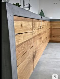 a kitchen counter made out of wood and concrete