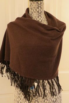 Lovely Portolano Cashmere Fringed Shawl – Chocolate – NWT - $400 A shawl in a classic brown cashmere but with a twist – the shawl has a rectangular body overall but the ends are tapered into a point … AND … the entire lower edge of the shawl has 4” leather fringe! Material: 100% cashmere.  Dry clean.  Dimensions: length – 72” and width – 22”. Brown Shawl Outfit, Off The Shoulder Shawl, Classic Brown Shawl Scarves, Brown Cashmere Shawl For Winter, Cashmere Pashmina Shawl For Fall, One Size Pashmina Shawl For Fall, Brown Cashmere Shawl, Classic Brown Cashmere Scarf, Brown Shawl Wrap For Fall