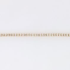 A stunning natural diamond tennis bracelet in 14k yellow gold. This classic design never goes out of style, make your statement with this string of sparkling diamonds, a perfect gift for yourself or someone you love. This bracelet has a secure clasp for worry free wear! As listed, this bracelet is ready to ship! If you would like a similar bracelet design with different stones, please let us know and we'd be happy to work with you on a custom piece! ~~~~~~ Fine Jewelry Yellow Gold Tennis Bracelet With Diamond Accents, Yellow Gold Diamond Tennis Bracelet With Vvs Clarity, Minimalist Yellow Gold Diamond Cut Tennis Bracelet, 14k Gold Diamond Cut Tennis Bracelet In Diamond White, Yellow Gold Tennis Bracelet With Diamond Accents, Diamond White Diamond Cut Tennis Bracelet In 14k Gold, White Diamond Cut 14k Gold Tennis Bracelet, Minimalist Yellow Gold Diamond Tennis Bracelet, 14k Yellow Gold Tennis Bracelet