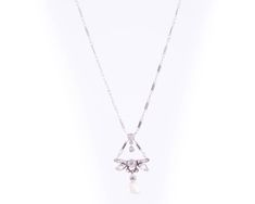 Item Description: This 1870s Victorian Dragonfly motif Necklace features a Natural Free Form Pearl and Old Mine Diamonds in 14 Karat White Gold and Platinum. A Diamond Dragonfly charm drops from the chain and suspends a diamond and pearl charm. The Natural Pearl measures approximately 7.5 millimeters and is Iridescent White with pinks and blues. It has natural rippling and dimpling. This delicate necklace measures 16 inches long and has a safety clasp for extra security. This piece shows that hi Antique White Gold Necklace With Pearl Pendant, Victorian White Gold Pendant Necklace, Antique White Gold Necklace With Diamond Accents, Antique White Gold Diamond Pendant Necklace, Antique White Gold Pendant Necklace, Antique White Gold Diamond Necklace For Wedding, Victorian Diamond Necklace For Wedding, Engraved White Gold Diamond Necklace For Formal Occasions, Elegant Engraved Necklaces For Evening