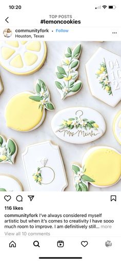 cookies decorated with yellow and white icing on top of a table next to each other